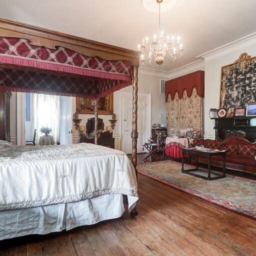 81 Rutledge Ave, Charleston, SC 29401 - bedroom with a chandelier, wood-type flooring, and crown molding