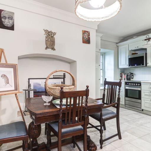 81 Rutledge Ave, Charleston, SC 29401 - dining room with light tile patterned floors and ornamental molding