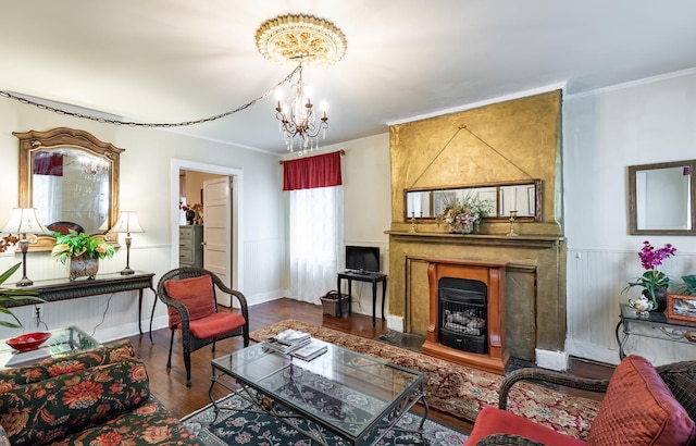81 Rutledge Ave, Charleston, SC 29401 - living area with wood finished floors, a chandelier, ornamental molding, and baseboards