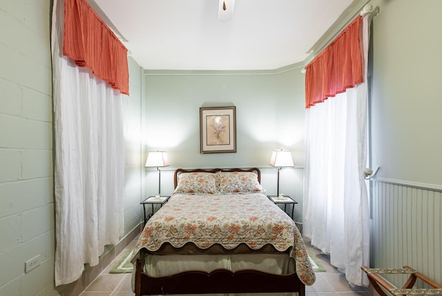 81 Rutledge Ave, Charleston, SC 29401 - bedroom featuring tile patterned flooring and concrete block wall