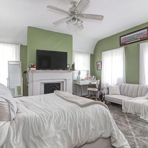 81 Rutledge Ave, Charleston, SC 29401 - bedroom featuring a ceiling fan, a fireplace, and vaulted ceiling