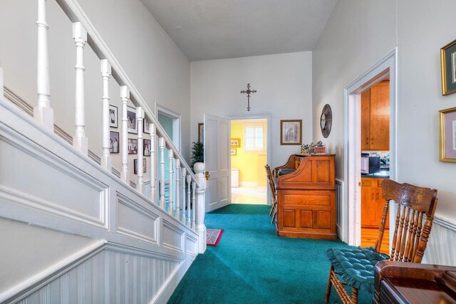 foyer entrance with carpet