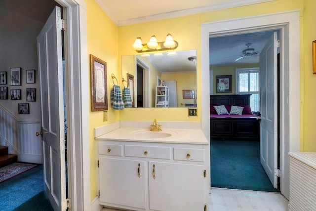 bathroom with crown molding and vanity