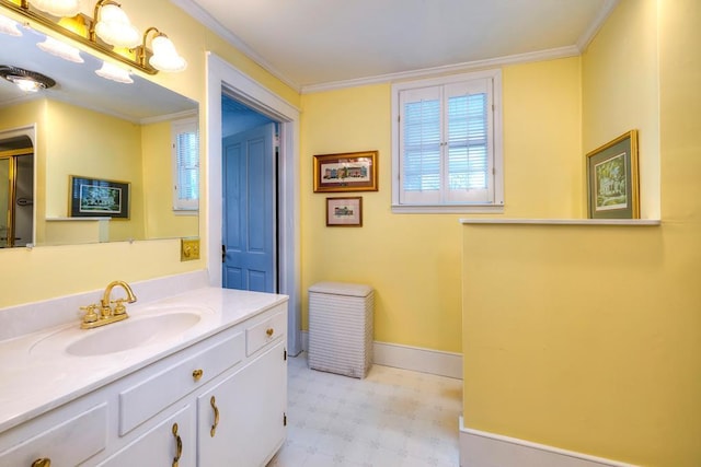 bathroom with vanity and ornamental molding