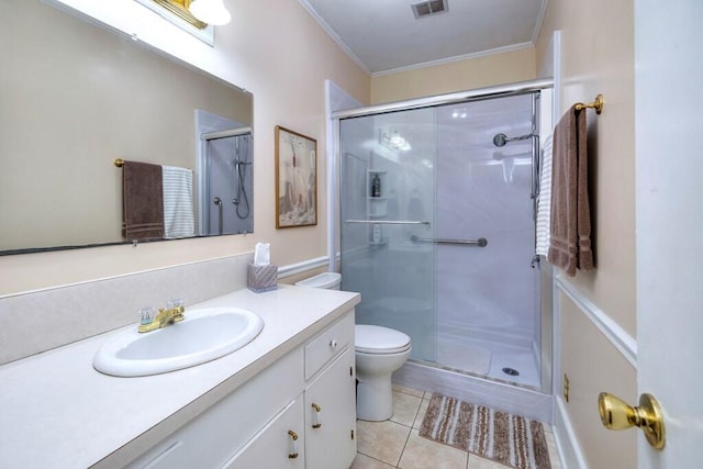 bathroom featuring tile patterned floors, walk in shower, vanity, crown molding, and toilet