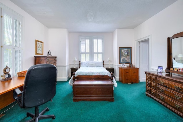 bedroom featuring dark carpet and a closet