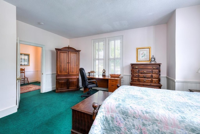 carpeted bedroom with a textured ceiling