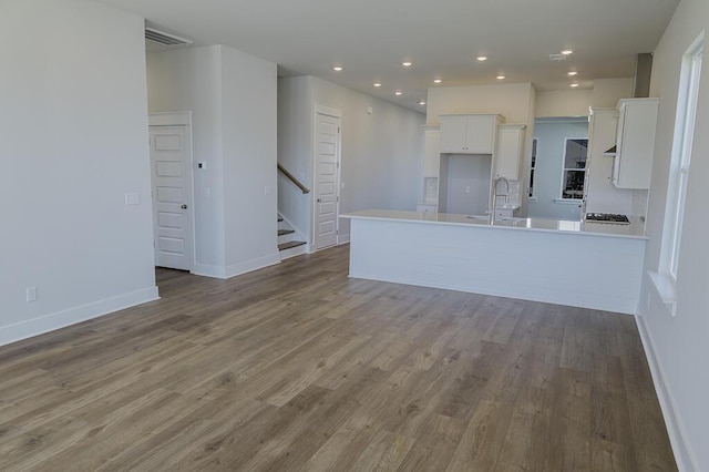 444 Parish Farms Dr, Summerville, SC 29486 - unfurnished living room featuring wood finished floors, stairs, and recessed lighting
