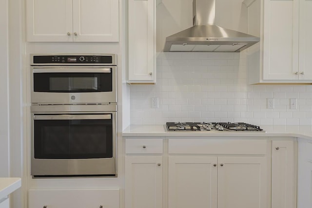 444 Parish Farms Dr, Summerville, SC 29486 - kitchen featuring wall chimney range hood, stainless steel appliances, and white cabinets