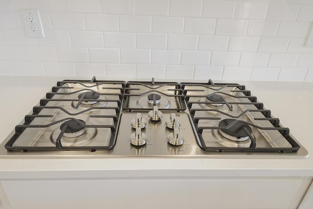 444 Parish Farms Dr, Summerville, SC 29486 - kitchen view of stainless steel gas cooktop, light countertops, and tasteful backsplash