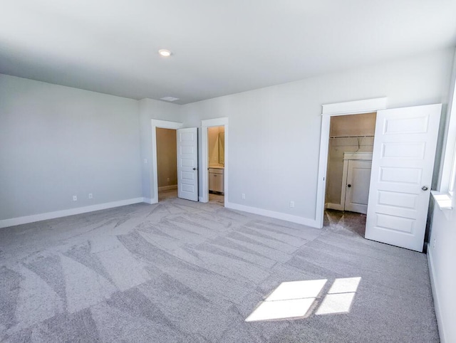 444 Parish Farms Dr, Summerville, SC 29486 - unfurnished bedroom with a walk in closet, light carpet, connected bathroom, and a closet