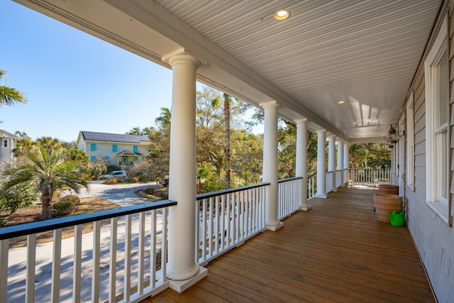 wooden terrace with a porch