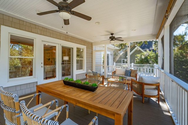 sunroom with a ceiling fan and a healthy amount of sunlight