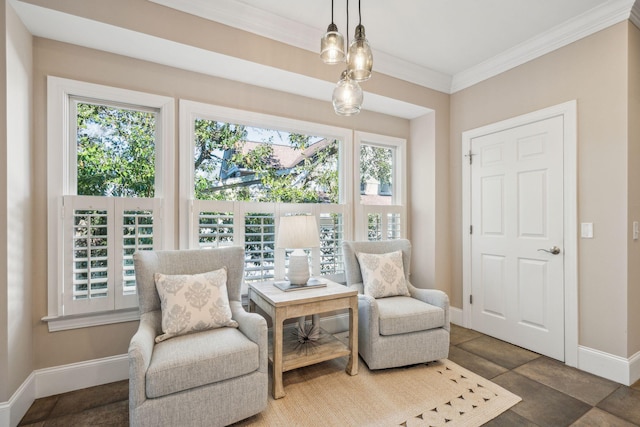 sitting room featuring baseboards and crown molding