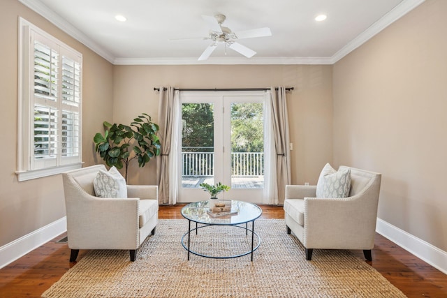 living area featuring crown molding, baseboards, wood finished floors, and recessed lighting