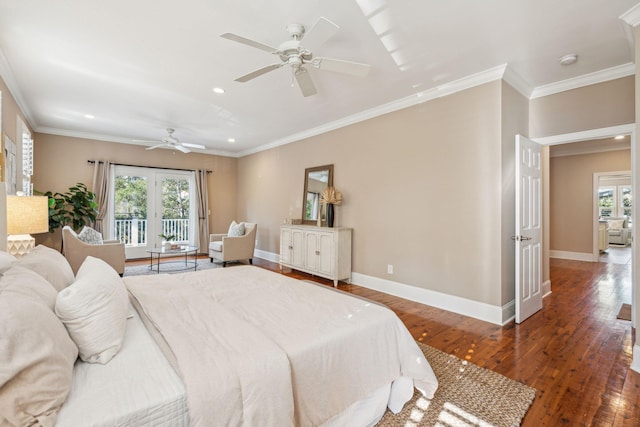 bedroom with multiple windows, hardwood / wood-style floors, and baseboards