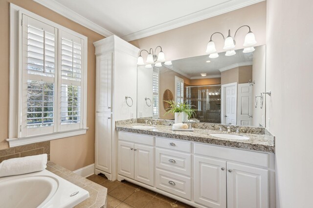 bathroom with a stall shower, tile patterned flooring, a sink, and crown molding