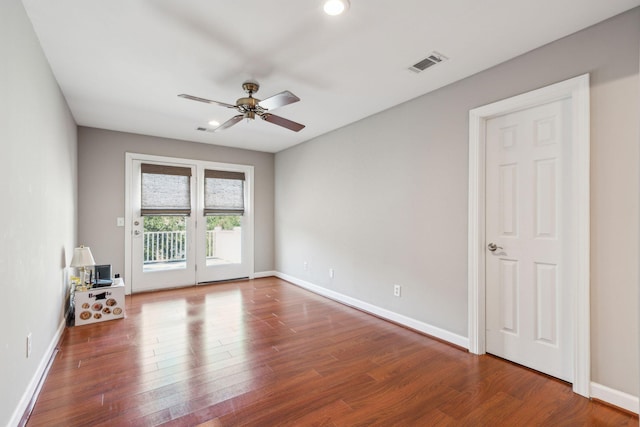 spare room featuring baseboards, visible vents, a ceiling fan, wood finished floors, and recessed lighting