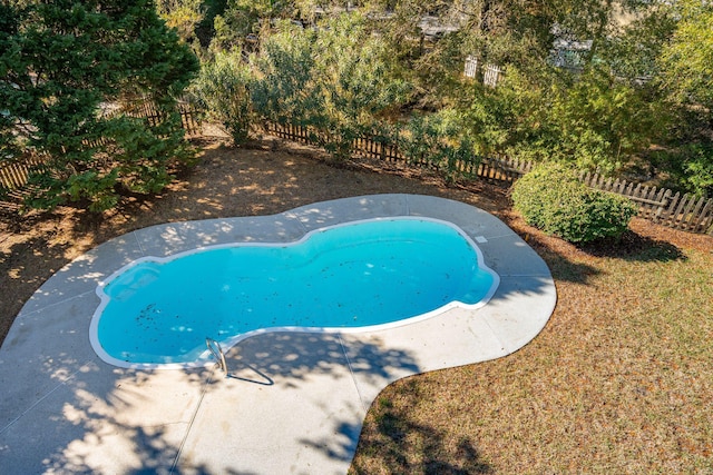 view of pool with a fenced backyard