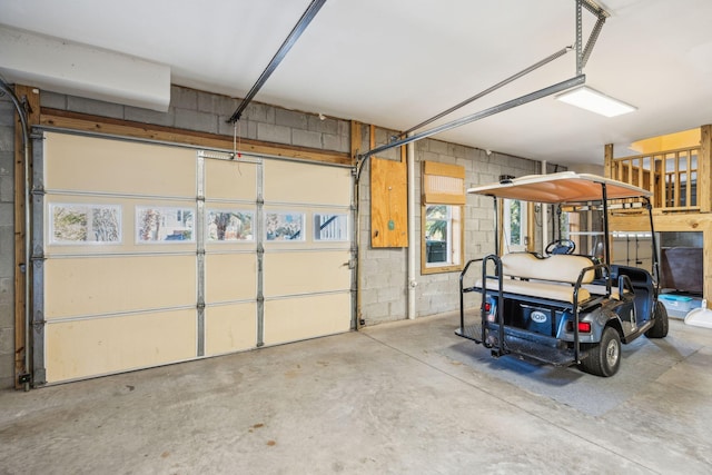 garage with concrete block wall