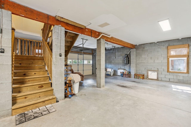 below grade area with concrete block wall and stairway