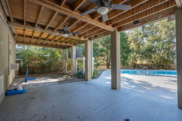 view of patio / terrace with a fenced backyard, a ceiling fan, and a fenced in pool