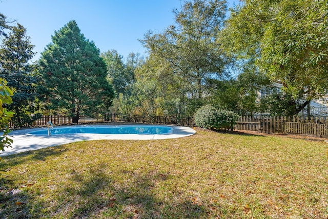 view of pool featuring a fenced in pool, a fenced backyard, and a lawn