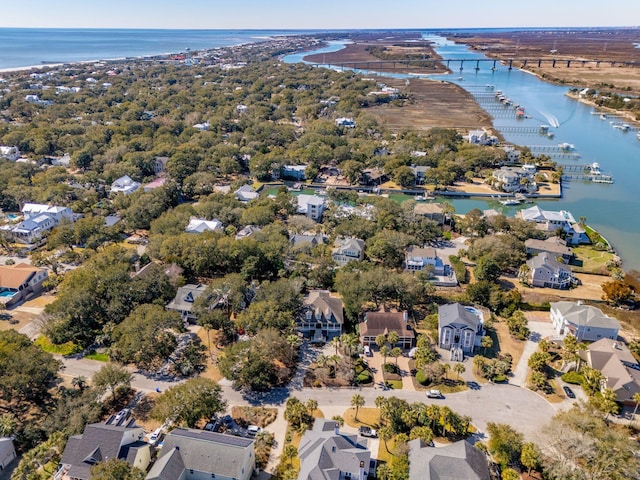 birds eye view of property with a water view and a residential view