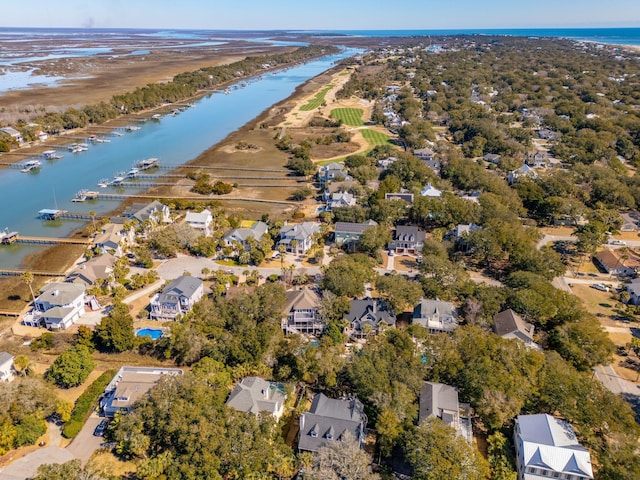 drone / aerial view with a water view and a residential view