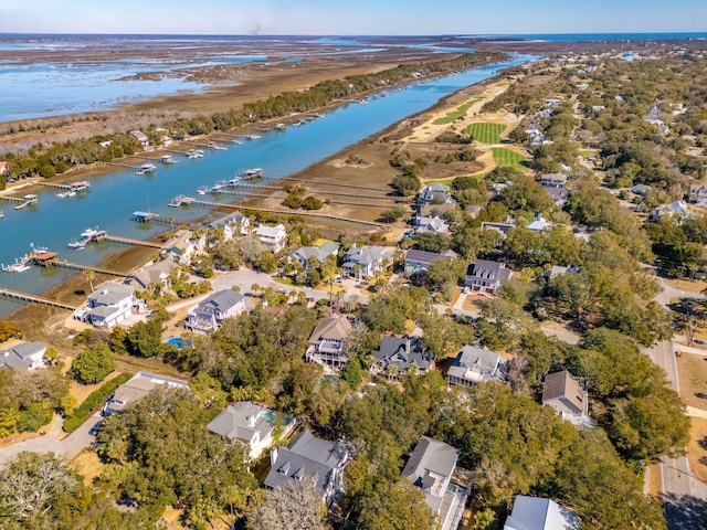 birds eye view of property featuring a water view and a residential view