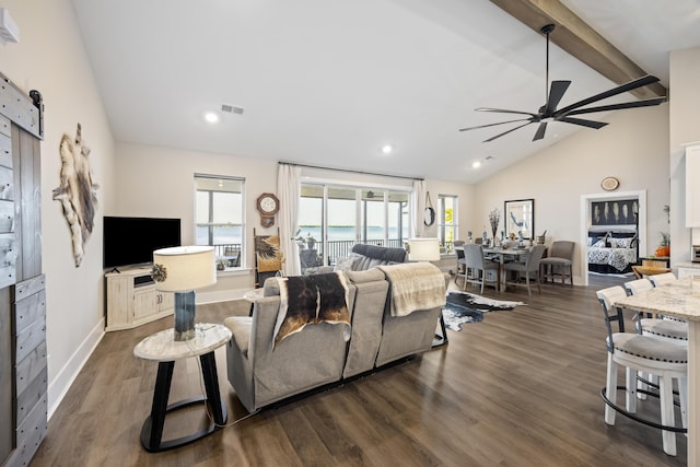 359 Green St, Santee, SC 29142 - living room featuring ceiling fan, dark wood-type flooring, beamed ceiling, a barn door, and high vaulted ceiling