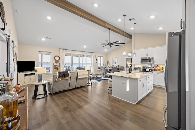 359 Green St, Santee, SC 29142 - kitchen with appliances with stainless steel finishes, open floor plan, a barn door, and white cabinets