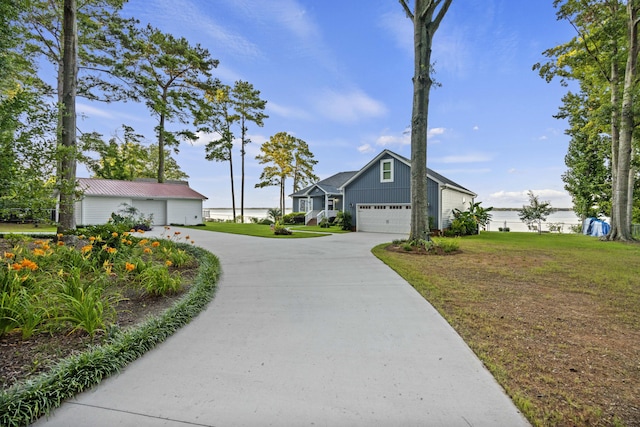 359 Green St, Santee, SC 29142 - view of front of house with board and batten siding, a front yard, driveway, and a garage
