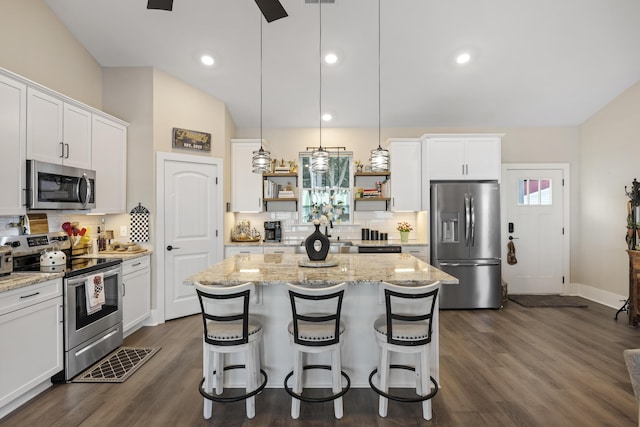 359 Green St, Santee, SC 29142 - kitchen featuring appliances with stainless steel finishes, decorative backsplash, open shelves, a kitchen island, and white cabinetry