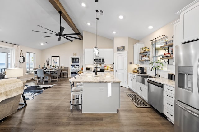 359 Green St, Santee, SC 29142 - kitchen featuring stainless steel appliances, a ceiling fan, open floor plan, white cabinets, and beam ceiling