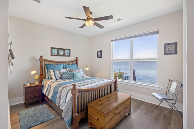 359 Green St, Santee, SC 29142 - bedroom with wood finished floors, a ceiling fan, and a water view