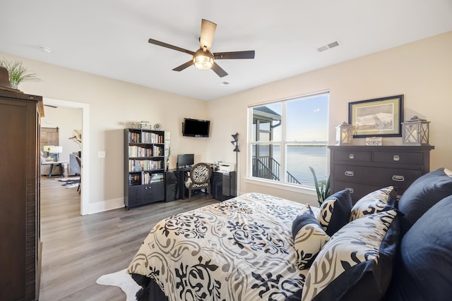 359 Green St, Santee, SC 29142 - bedroom with light wood finished floors and ceiling fan