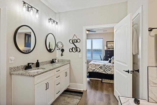 359 Green St, Santee, SC 29142 - full bathroom with connected bathroom, double vanity, wood finished floors, ceiling fan, and a water view