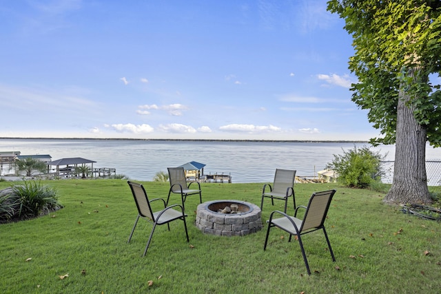 359 Green St, Santee, SC 29142 - view of green lawn featuring an outdoor fire pit and a water view