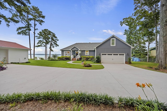 359 Green St, Santee, SC 29142 - single story home with driveway, a front lawn, board and batten siding, a water view, and an attached garage