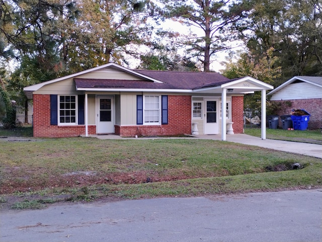 ranch-style house with a front lawn and a carport