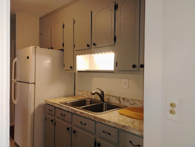 kitchen with white fridge and sink