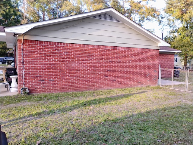 view of home's exterior with a lawn