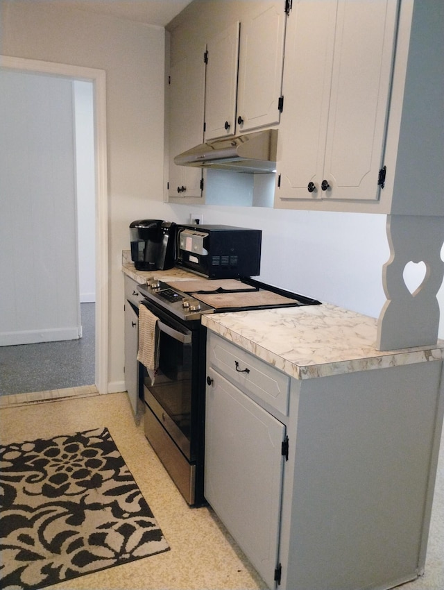 kitchen with white cabinetry and stainless steel range