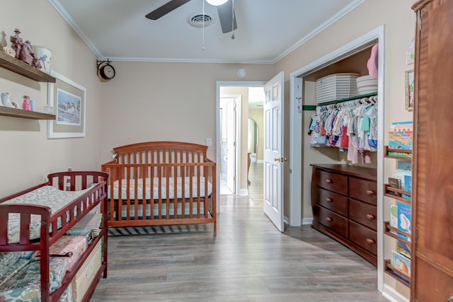 403 Forest Cir, Summerville, SC 29483 - bedroom with crown molding, a closet, wood finished floors, and visible vents