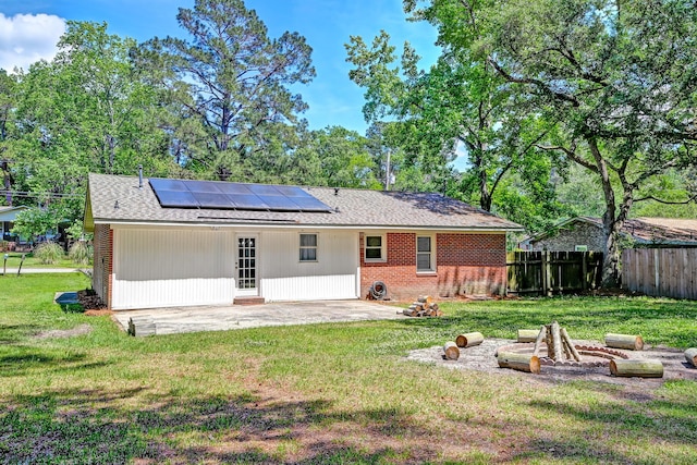 403 Forest Cir, Summerville, SC 29483 - back of property with fence, a patio, brick siding, a yard, and solar panels