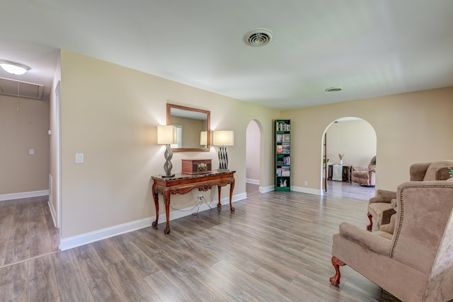 403 Forest Cir, Summerville, SC 29483 - sitting room featuring visible vents, arched walkways, wood finished floors, and attic access