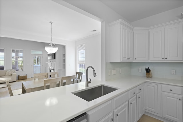 132 Fresh Meadow Ln, Mount Pleasant, SC 29466 - kitchen featuring white cabinets, healthy amount of natural light, light countertops, and crown molding