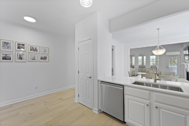 132 Fresh Meadow Ln, Mount Pleasant, SC 29466 - kitchen featuring dishwasher, white cabinets, light wood finished floors, light countertops, and decorative light fixtures