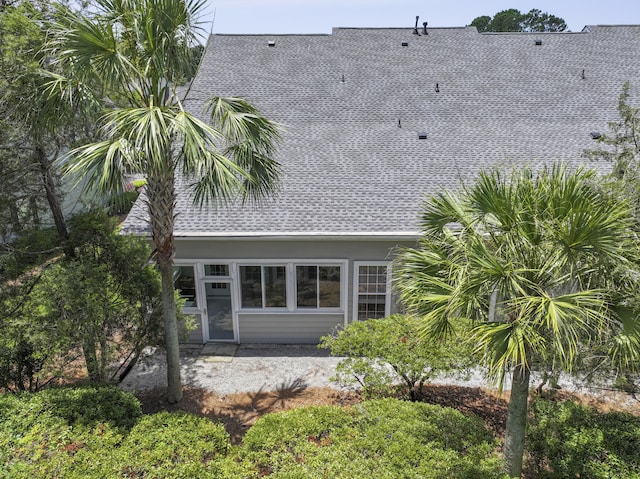 132 Fresh Meadow Ln, Mount Pleasant, SC 29466 - view of home's exterior with a sunroom, a shingled roof, and a patio area